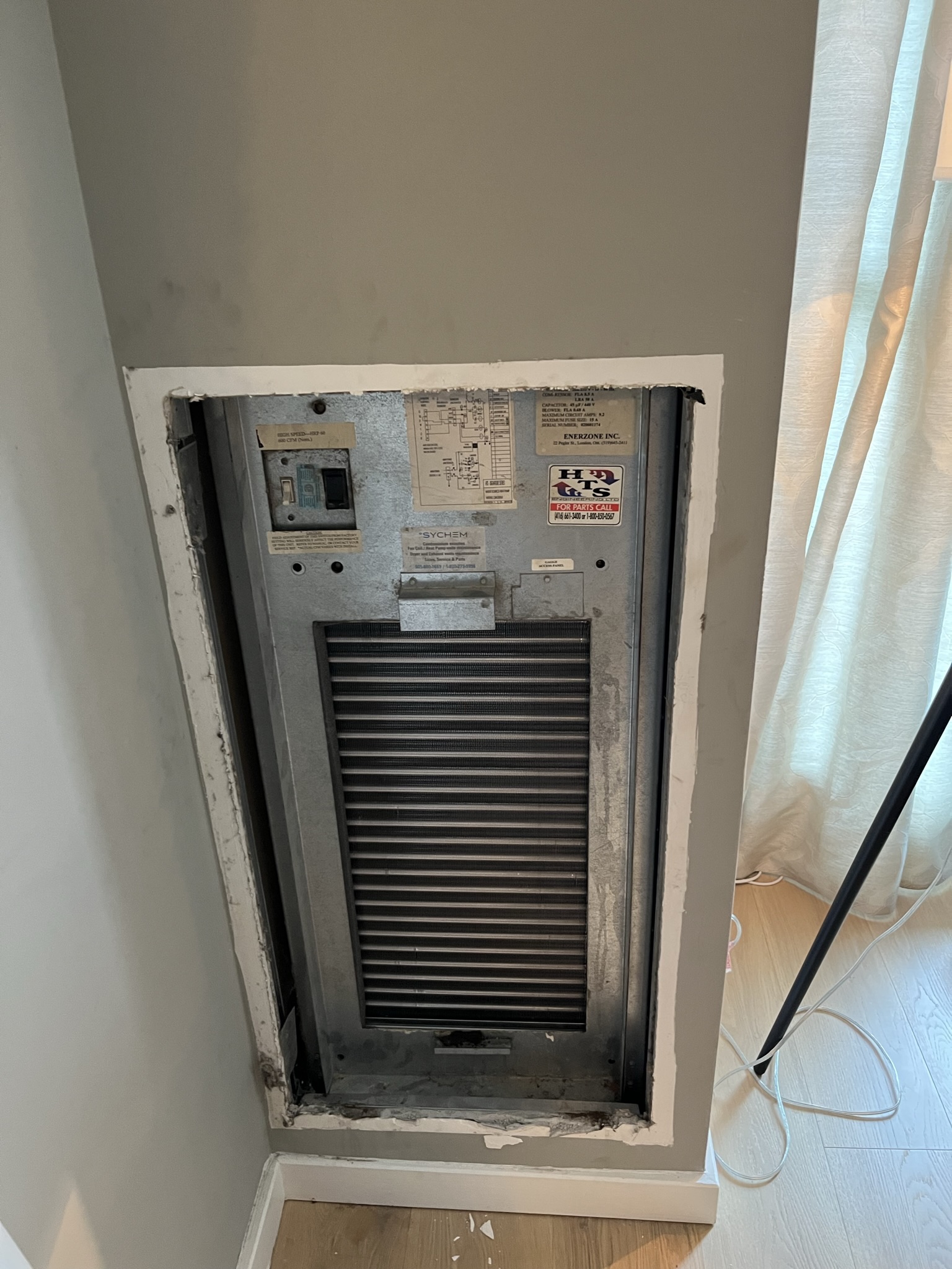 Water source heat pump unit inside a Toronto condo suite serviced by Epsilon Mechanical