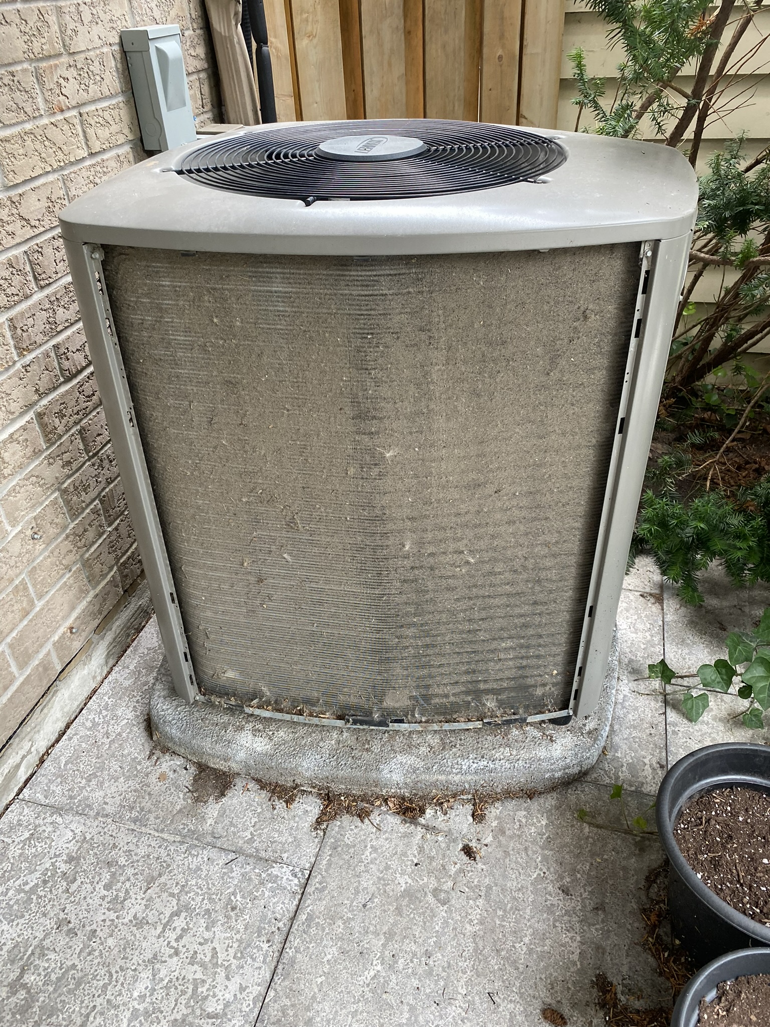 Dirty AC condenser coil before spring tune-up Toronto by Epsilon Mechanical