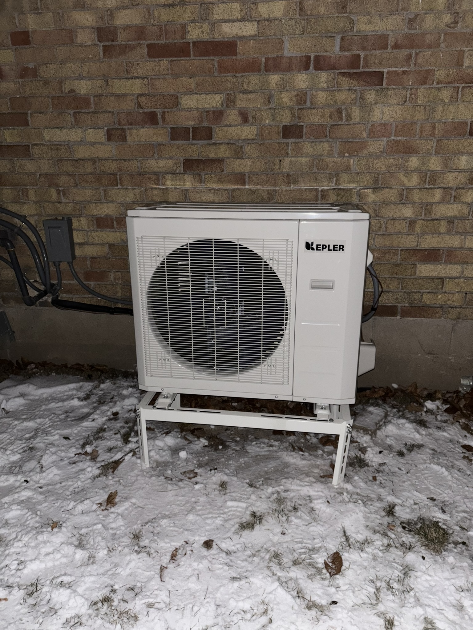 Kepler heat pump installed outside Toronto home in winter by Epsilon Mechanical