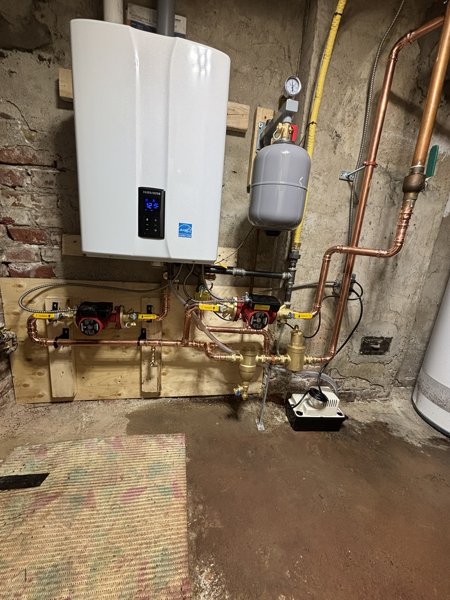 Navien combi-boiler installation with copper piping in a Toronto basement by Epsilon Mechanical