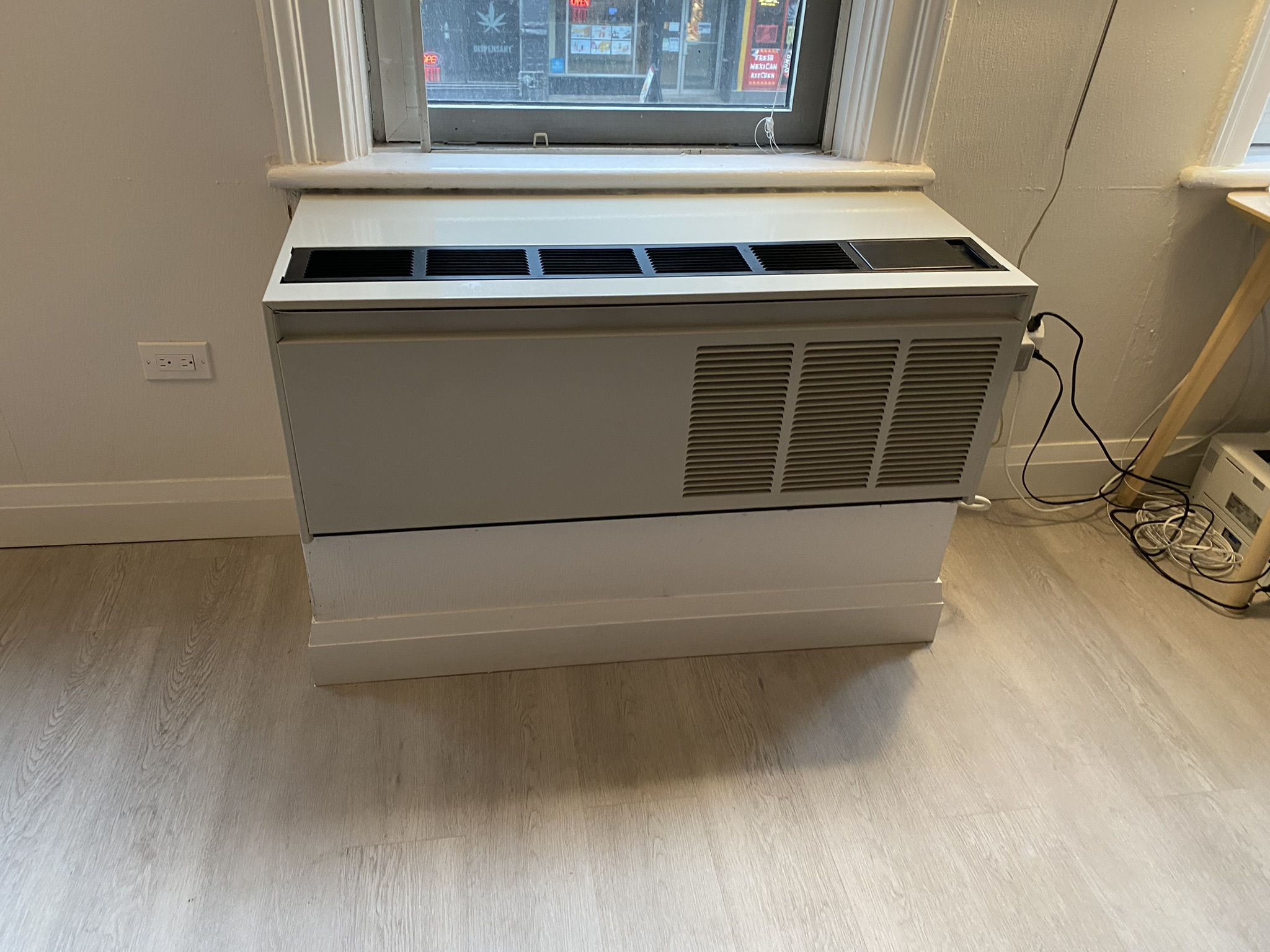 PTAC packaged terminal air conditioner unit in a Toronto condo suite serviced by Epsilon Mechanical